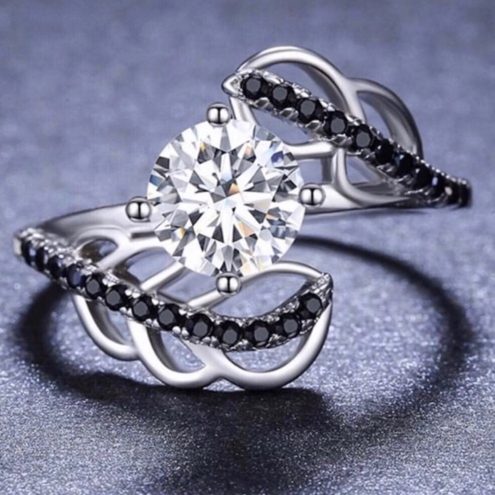 Silver Ring with Clear Center Stone and Black Accent Stones